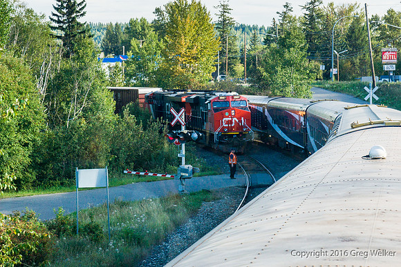 Passing A Freight At River Park Road In Quesnel