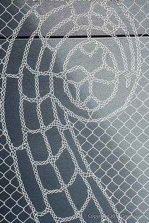 Art Woven Into Chain Link Fence.