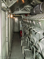 Behind the engineer's seat is a door leading to the engine room.