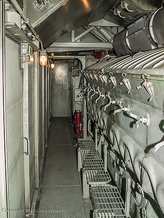 Behind the engineer's seat is a door leading to the engine room.